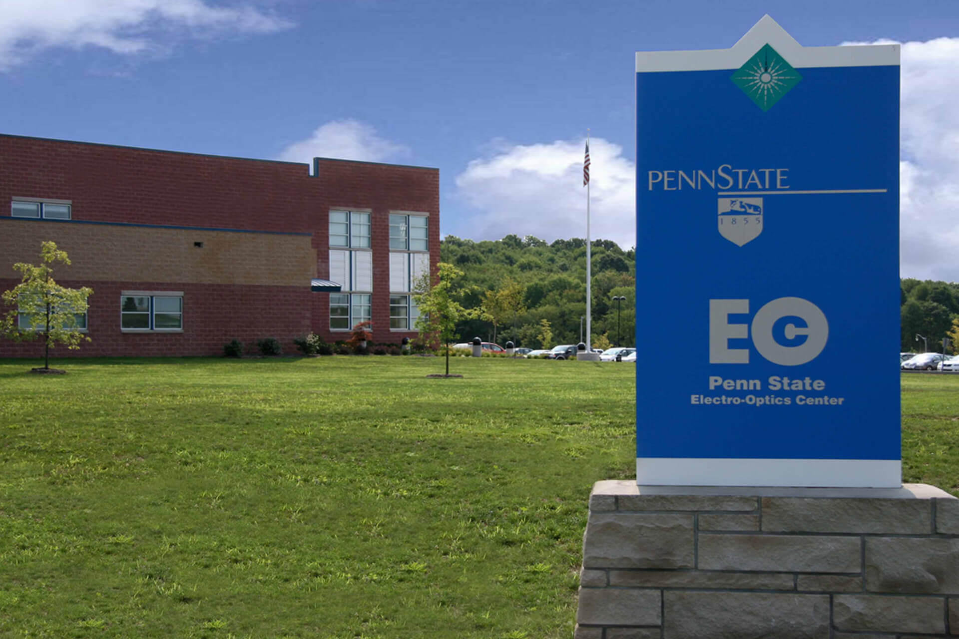Sign for Penn State Erie, The Behrend College on a grassy lawn.