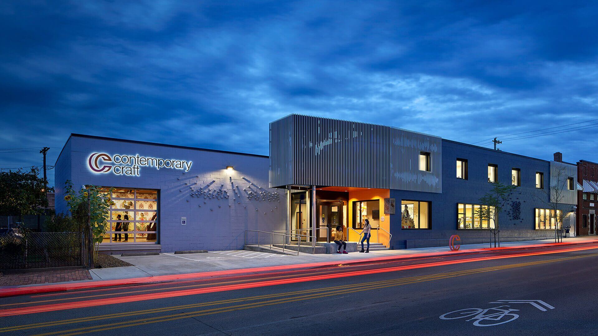 Contemporary Craft museum exterior with evening light trails