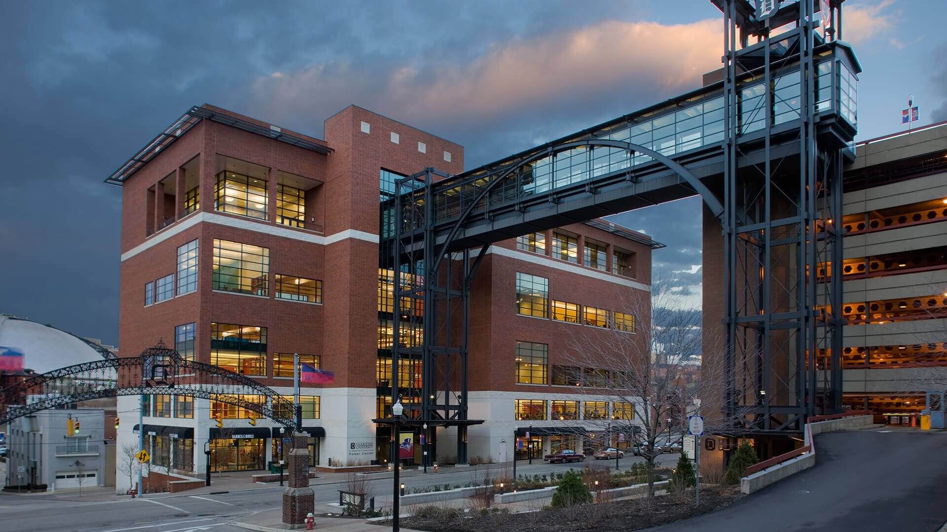 Red brick office complex with glass skybridge