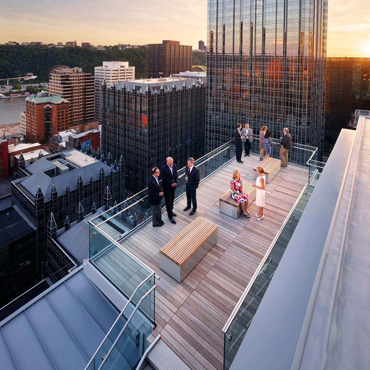 Rooftop terrace business networking at sunset