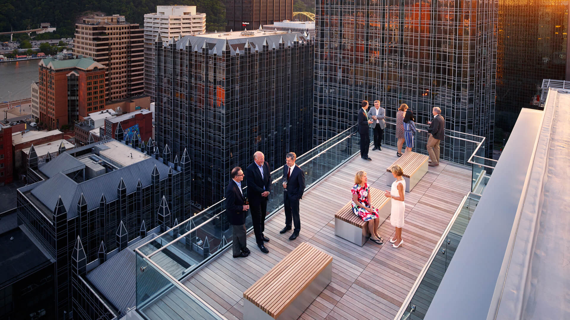 Business professionals networking on rooftop terrace