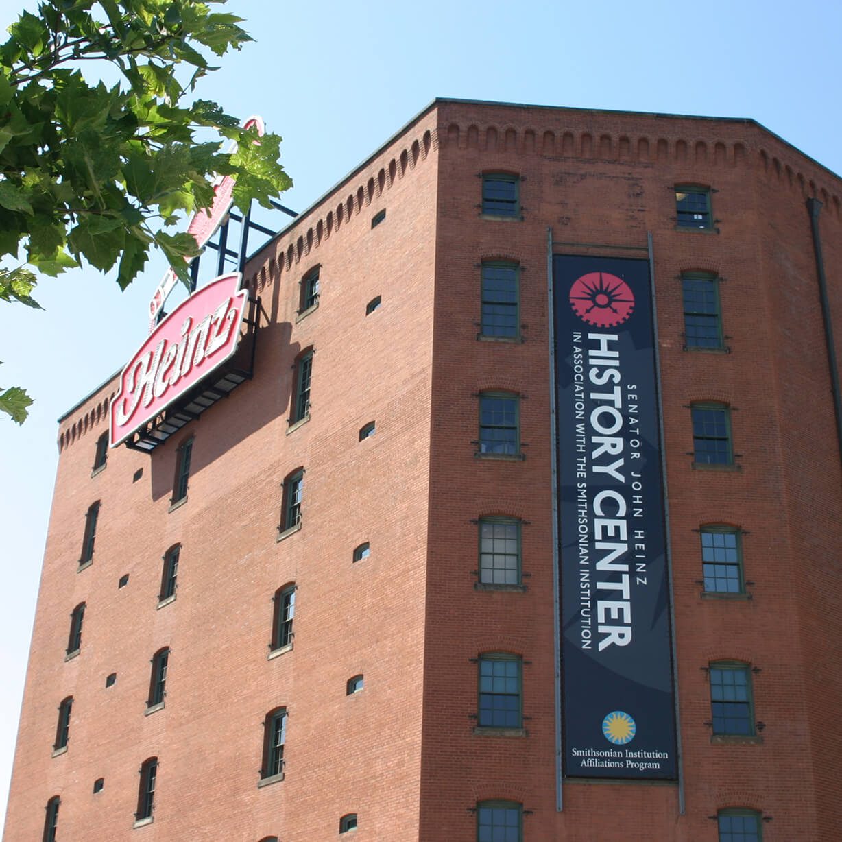 Red brick history center with vertical banner