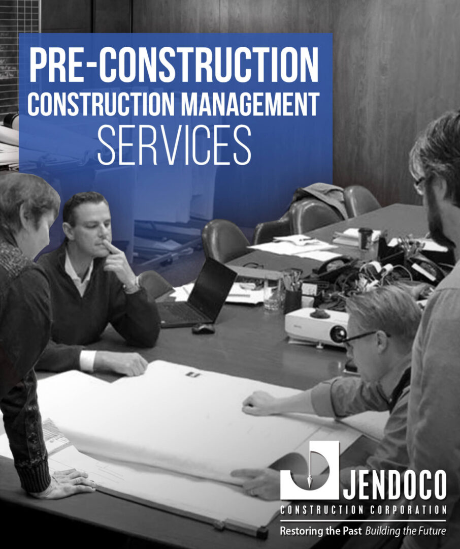 Construction team reviewing plans at pre-construction meeting