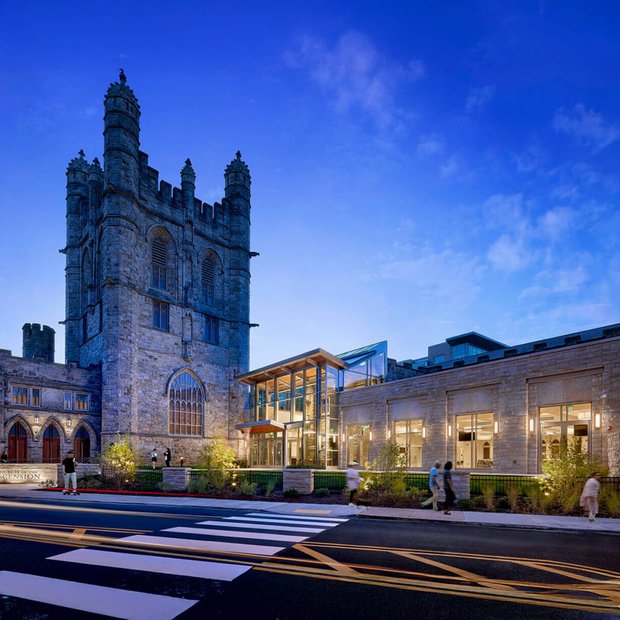 Historic stone church with modern glass entrance